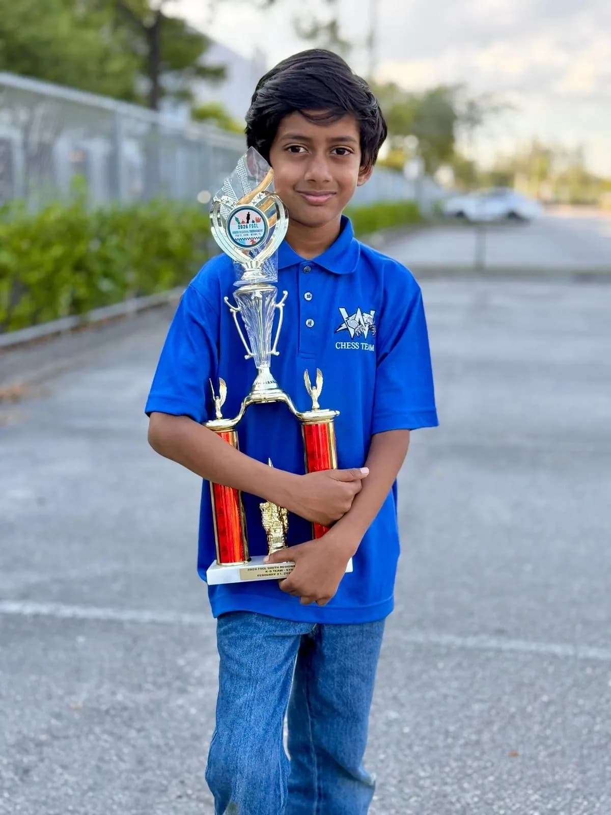 A young Destiny Chess Academy student celebrating a chess achievement